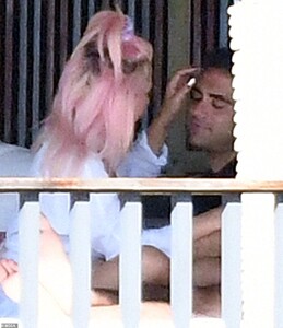 24182834-7956697-PDA_She_ran_her_fingers_through_his_hair_as_they_relaxed_by_the_-a-63_1580610051519.jpg