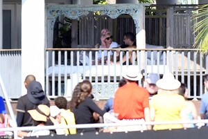 24182856-7956697-Private_moment_A_boat_of_onlookers_passed_by_the_waterfront_resi-a-60_1580610051342.jpg