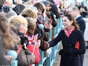24293990-7964773-Windswept_The_Duke_and_Duchess_of_Cambridge_spent_time_greeting_-a-8_1580831677937.jpg