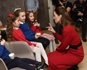 24296046-7964773-Natural_warmth_The_Duchess_of_Cambridge_crouched_down_to_speak_t-a-32_1580831677997.jpg