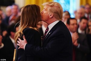 24407004-7975443-Cheeked_The_first_lady_turned_her_cheek_to_the_smooch_facing_the-a-100_1581024308261.jpg