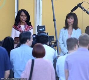 24785946-8008195-In_character_Kerry_looked_preppy_as_she_took_the_mic_wearing_a_b-m-60_1581802275347.jpg