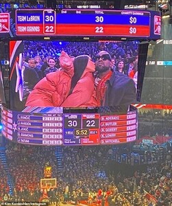 24840582-8012657-Lip_service_When_the_kiss_cam_landed_on_Kim_and_Kanye_she_gamely-a-56_1581957344583.jpg