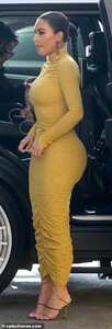 24965312-8023515-Bottom_s_up_The_dress_also_hugged_her_famous_behind-a-68_1582183698911.jpg