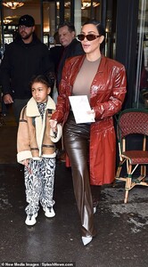 25436338-8065387-North_showed_off_her_own_individual_sense_of_style_in_a_suede_ta-a-69_1583166178723.jpg