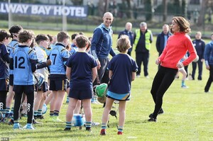 25579866-8077861-The_Duchess_of_Cambridge_tries_out_Gaelic_football_during_a_visi-a-359_1583424603472.jpg
