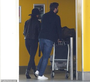 26524958-8163115-Away_they_go_The_couple_were_later_seen_entering_Gatwick_Airport-a-31_1585407669881.jpg