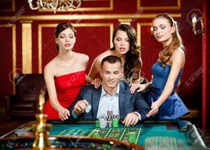 17824614-man-surrounded-by-girls-plays-roulette-at-the-casino.jpg