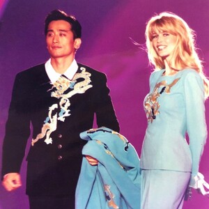 Korean actor Inpyo Cha and super model Claudia Schiffer wearing André Kim collection (1998).jpg