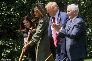 27518852-8246331-Karen_Pence_and_Melania_Trump_shared_a_shovel_to_plant_the_tree_-a-43_1587585242739.jpg