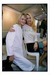 Vintage photo of Claudia Schiffer backstage at a fashion show with Alexander McQueen for Louis Vuitton.jpg