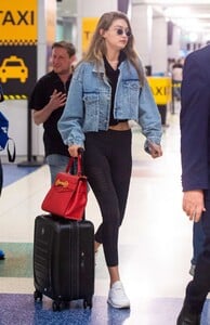 gigi-hadid-wears-cut-off-denim-jacket-and-black-leggings-as-she-touches-down-at-jfk-international-airport-in-new-york-010918_4.jpg