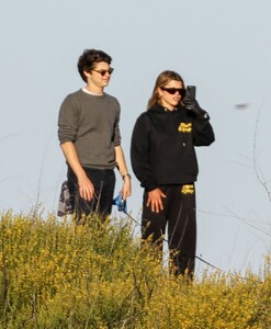 sofia-richie-in-black-hoodie-and-matching-mada-honeys-sweatpants-hiking-in-malibu-05-14-2020-5.jpg