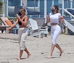 30401982-8490863-Girl_time_Sofia_and_her_female_companion_walked_along_the_shore_-a-31_1593919943047.jpg