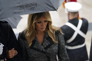 35562720-8938595-Melania_was_escorted_by_a_Military_member_as_her_husband_partici-a-38_1605120779337.jpg