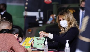 36604272-9030983-Melania_Trump_joined_the_children_in_making_holiday_cards_for_th-a-39_1607460467554.jpeg