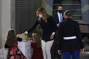 36604958-9030983-The_first_lady_helps_the_kids_put_the_toys_in_their_proper_bin-a-1_1607468512391.jpeg