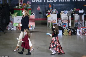 36604960-9030983-Melania_Trump_and_the_children_divided_donated_gifts_into_boy_bo-a-40_1607460467567.jpeg