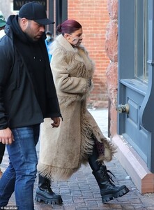 37507012-9105775-Cozy_Her_coat_s_hems_and_pockets_were_decorated_with_long_furry_-a-124_1609573735395.jpeg