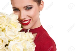 71584597-portrait-of-a-beautiful-young-smiling-woman-holding-bunch-of-white-roses-and-looking-at-camera-.jpg