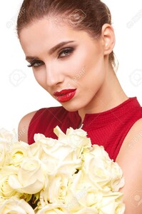 71589434-woman-holding-bunch-of-white-roses-and-looking-at-camera-valentines-day-cocept.jpg