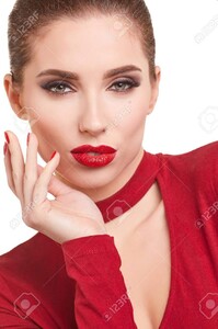 72218436-portrait-of-a-cheerful-young-brunette-woman-in-red-dress-posing-and-looking-away-over-white-backgrou.jpg
