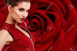 72218439-pretty-woman-on-red-rose-background-sensual-portrait.jpg