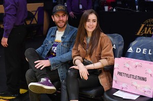 lily_collins_at_a_los_angeles_lakers_(2).jpg