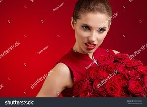 stock-photo-beautiful-surprised-woman-with-red-lips-posing-with-flowers-in-the-studio-on-a-valentines-day-580250209.jpg