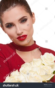 stock-photo-portrait-of-a-beautiful-young-smiling-woman-holding-bunch-of-white-roses-and-looking-at-camera-576348265.jpg