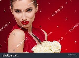 stock-photo-portrait-of-a-beautiful-young-smiling-woman-holding-bunch-of-white-roses-and-looking-at-camera-603078773.jpg