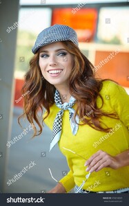 stock-photo-pretty-adult-woman-with-a-suitcase-near-the-train-on-the-platform-576018325.jpg