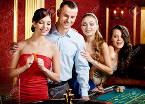 17824538-group-of-people-playing-roulette-at-the-casino.jpg