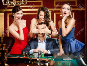 17824579-girls-cover-the-eyes-of-the-gambler-playing-roulette-at-the-casino.jpg