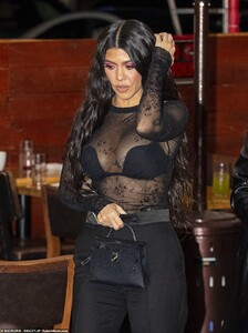 39731862-9296959-Knockout_look_The_diva_was_wearing_a_very_sheer_black_top_over_a-a-183_1614205832808.jpg