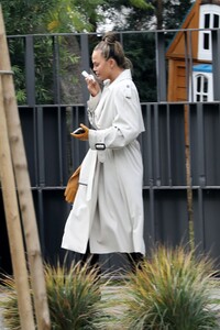 chrissy-teigen-boarding-a-private-jet-in-la-01-19-2021-4.jpg