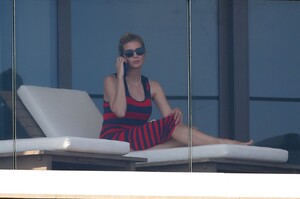 ivanka-trump-in-a-red-and-black-striped-dress-on-her-balcony-in-miami-02-08-2021-0.jpg