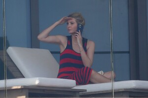 ivanka-trump-in-a-red-and-black-striped-dress-on-her-balcony-in-miami-02-08-2021-2.jpg