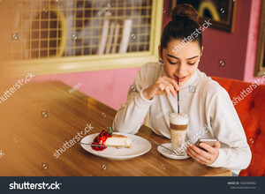 stock-photo-girl-with-phone-drinking-coffee-in-a-cafe-1082908982.jpg