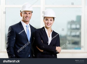 stock-photo-portrait-of-two-engineers-standing-near-each-other-129253403.jpg
