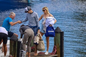 40175760-9336237-Kushner_is_seen_helping_his_father_off_the_boat_after_the_family-a-3_1615157177237.jpg