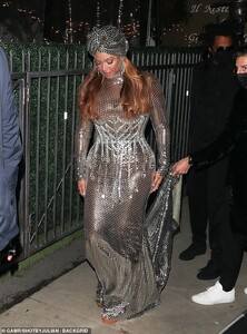 40478692-9362569-Regal_Queen_Bey_39_sparkled_in_a_grand_silver_sequined_ballgown_-m-68_1615790668891.jpg