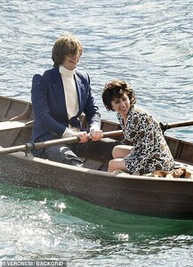 40637494-9376799-Ha_Something_happening_across_the_water_appeared_to_have_amused_-a-12_1616091002257.jpg