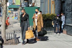 chrissy-teigen-in-a-full-length-black-leather-coat-and-open-toe-high-heels-ny-03-07-2021-3.jpg