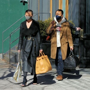 chrissy-teigen-in-a-full-length-black-leather-coat-and-open-toe-high-heels-ny-03-07-2021-5.jpg