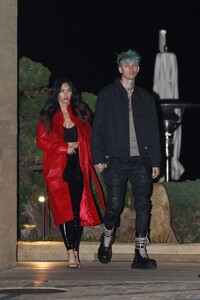 megan-fox-weaning-a-long-red-leather-trench-coat-and-pvc-pants-nobu-in-malibu-03-18-2021-3.jpg