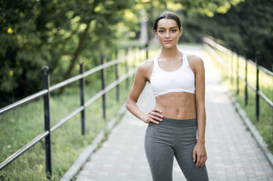 stretching-girl-pleasure-phone-sportswear-young.jpg