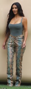 41475876-9447887-Figure_flattering_Kim_put_her_famous_assets_on_display_in_an_oli-a-134_1617846338310.jpg