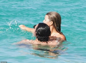 41915844-9484959-PDA_The_pair_were_not_shy_about_their_affection_as_they_wrapped_-a-54_1618779449429.jpg