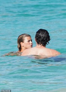 41915858-9484959-Affectionate_She_had_the_look_of_love_in_her_eyes_as_she_smiled_-a-58_1618779449443.jpg
